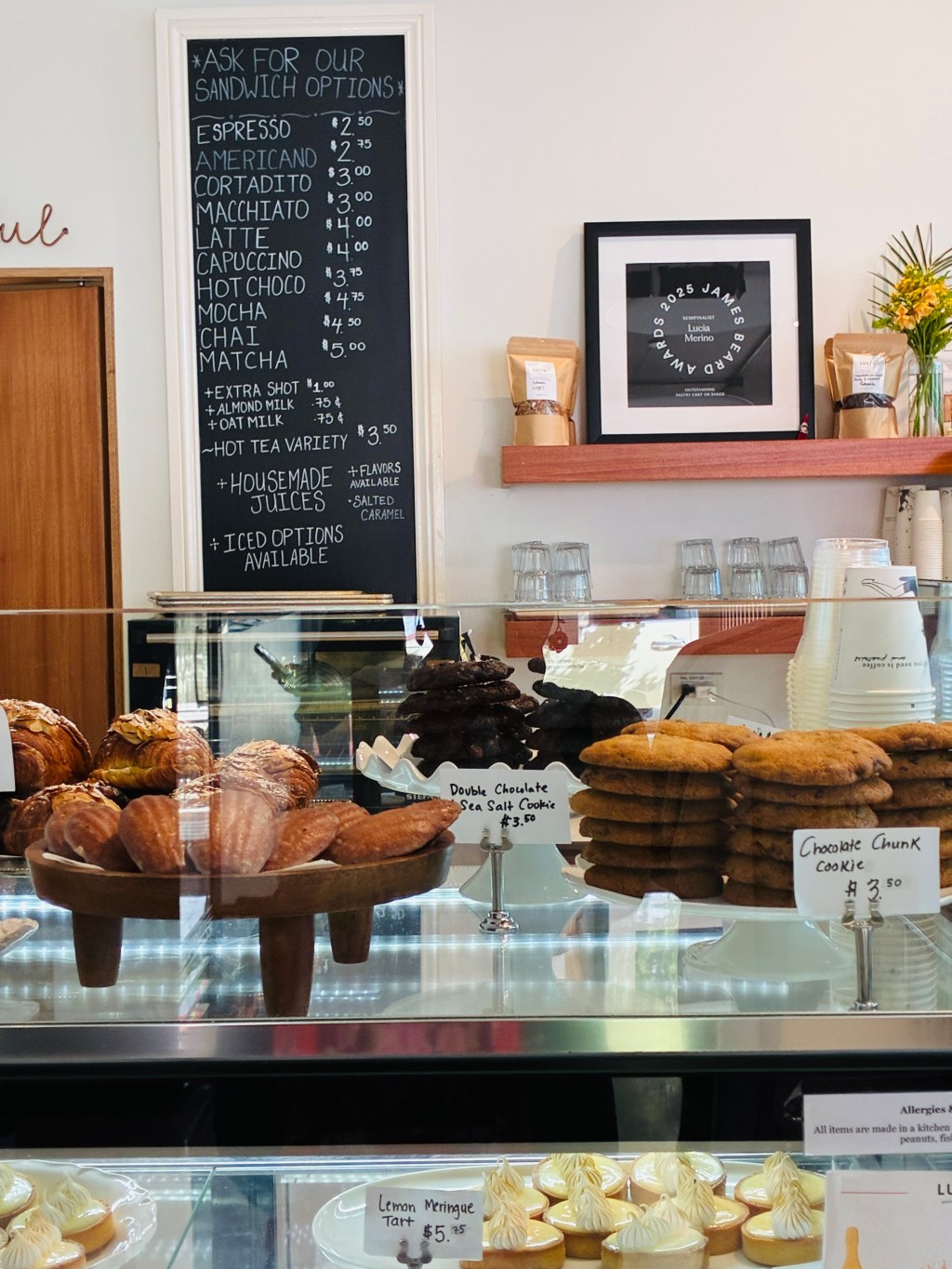 Fresh bread and pastries displayed inside a cozy neighborhood bakery.